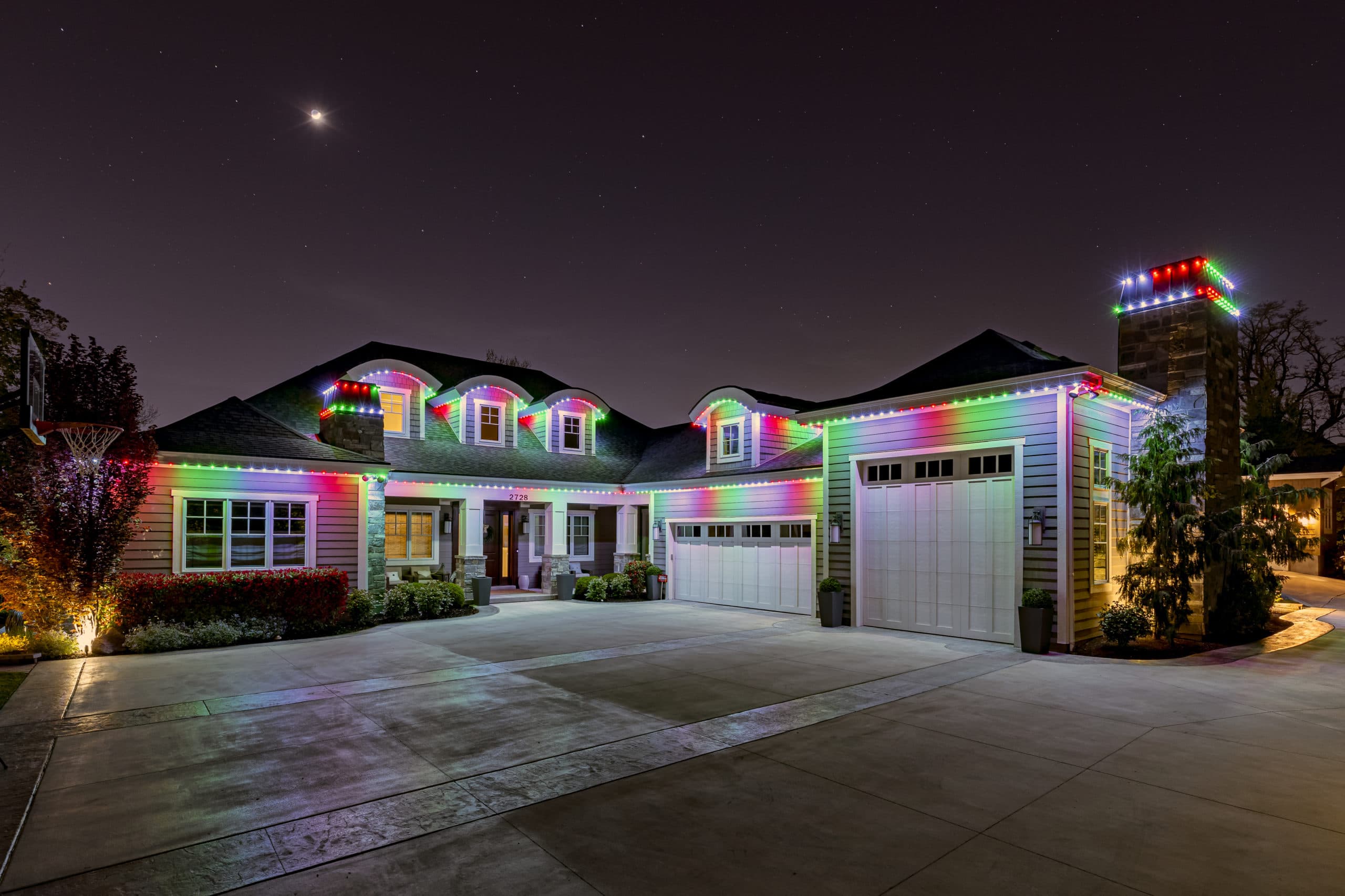 Forever Lights blue holiday LED installation on two-storey home