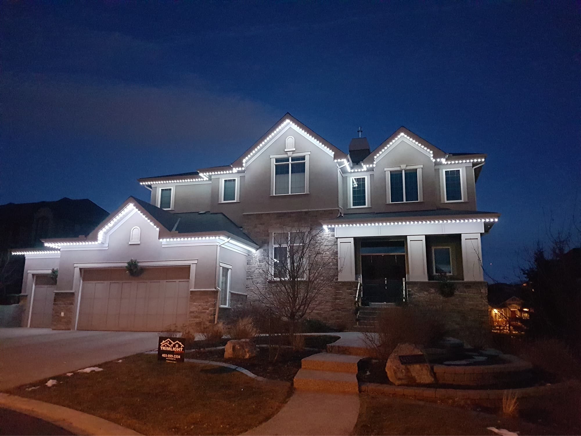 Multicolour permanent outdoor LED accent lighting on Ontario home by Forever Lights
